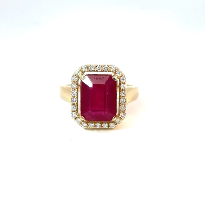 Front-facing view of John's Loan & Jewelry's 14k yellow gold ring, featuring a rectangular ruby solitaire enclosed by a halo of round-cut diamond accents.