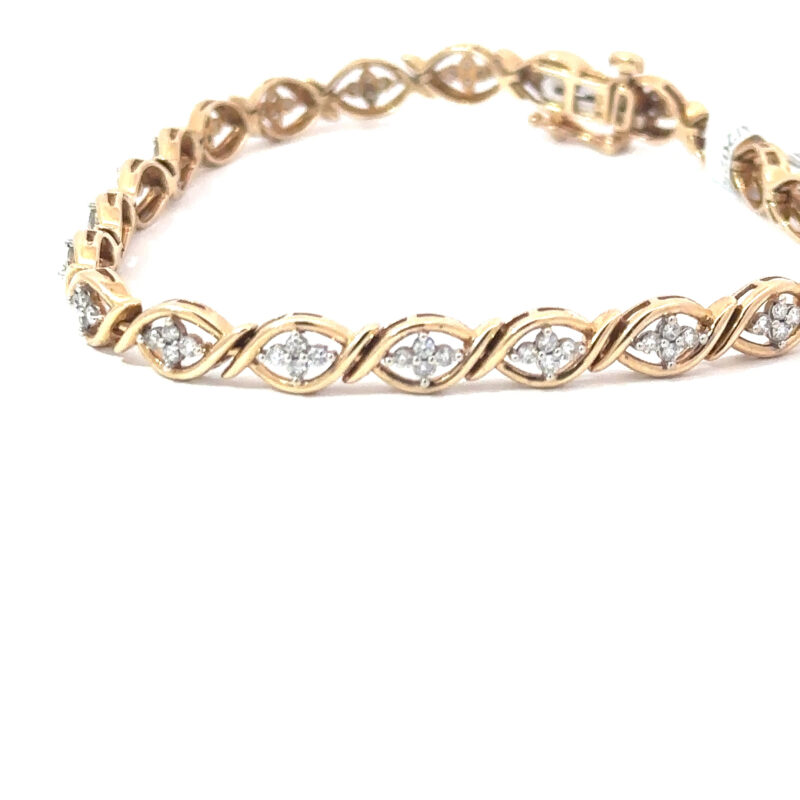 Close-up detail of a 'Fleur' ladies bracelet from John's Loan & Jewelry, crafted in 10kt gold with diamond accents, showcasing its elegant design.