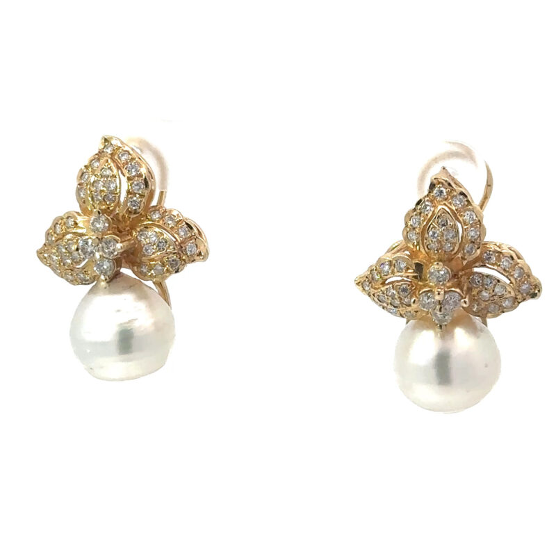 Stunning 14k yellow gold earrings featuring a pair of white pearls and diamond accents, available from John's Loan & Jewelry Co.