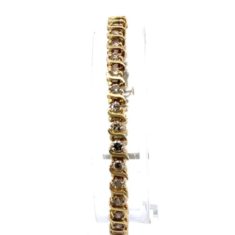 Close-up of a 14k yellow gold tennis bracelet, showcasing the 4ct diamonds, available at John's Loan & Jewelry, a Las Vegas pawn shop specializing in fine jewelry.