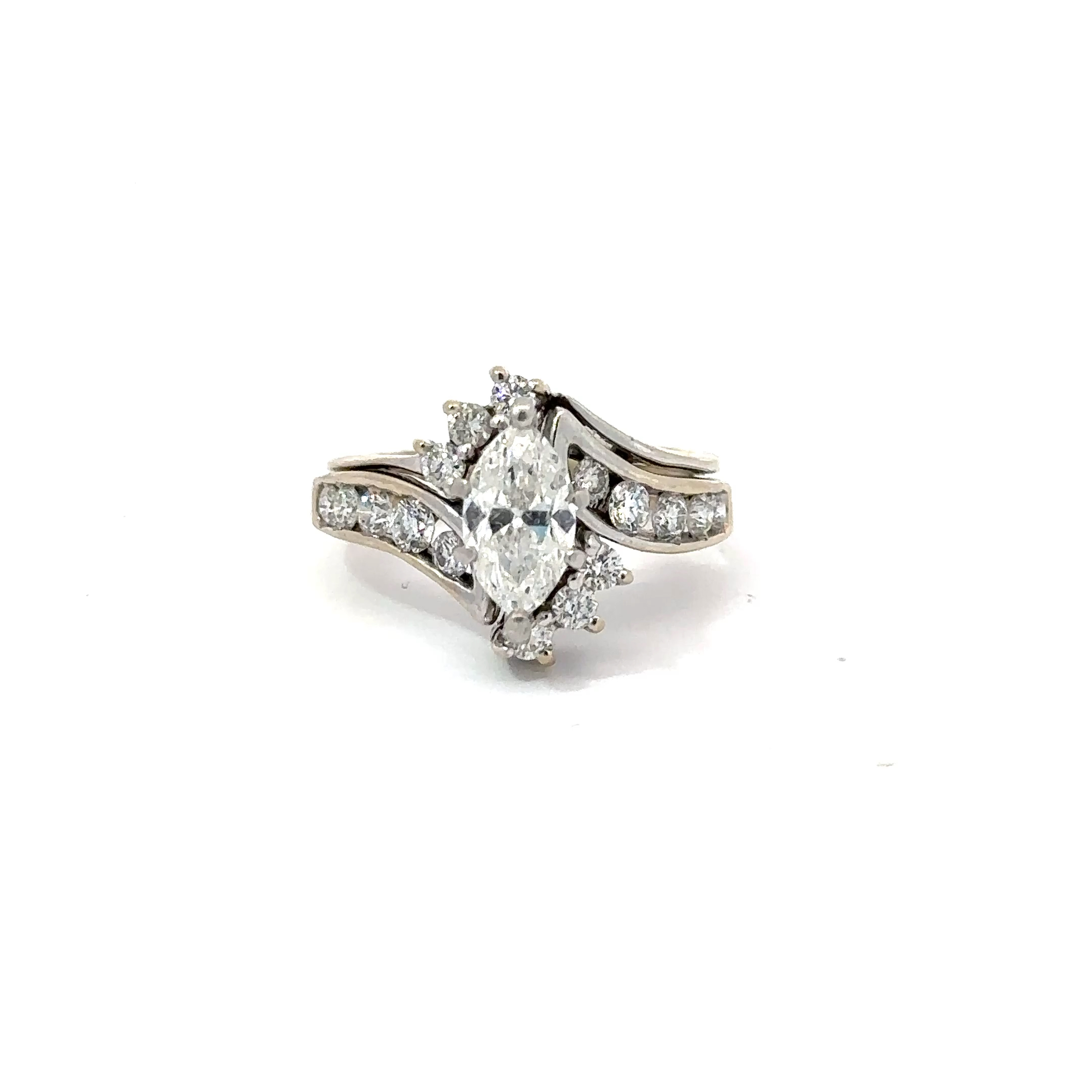 Close-up of John's Loan & Jewelry 14kt white gold engagement ring showcasing a brilliant 1ct marquise cut diamond set with smaller accent diamonds.