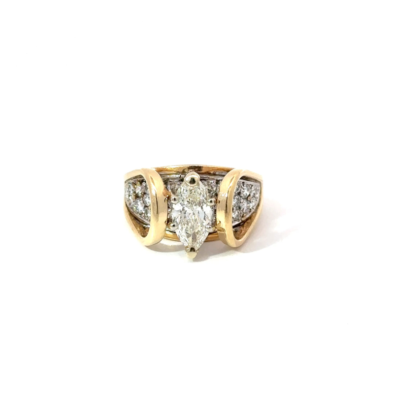 Front-facing view of John's Loan & Jewelry's 14k yellow gold ring featuring a 1.1ct marquise diamond. The 'suspension bridge' design showcases pave-set diamonds flanking the marquise on the jewelry piece.